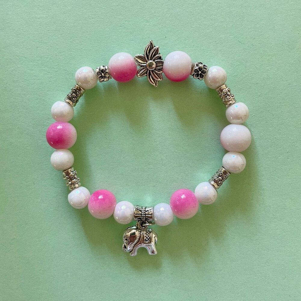 Handmade bracelet with beads and dangling elephant charm 🗃️